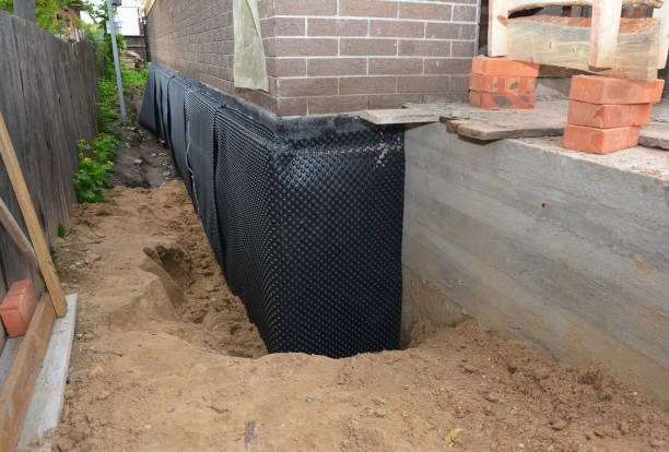 Happy homeowners after waterproofing job in Shakopee